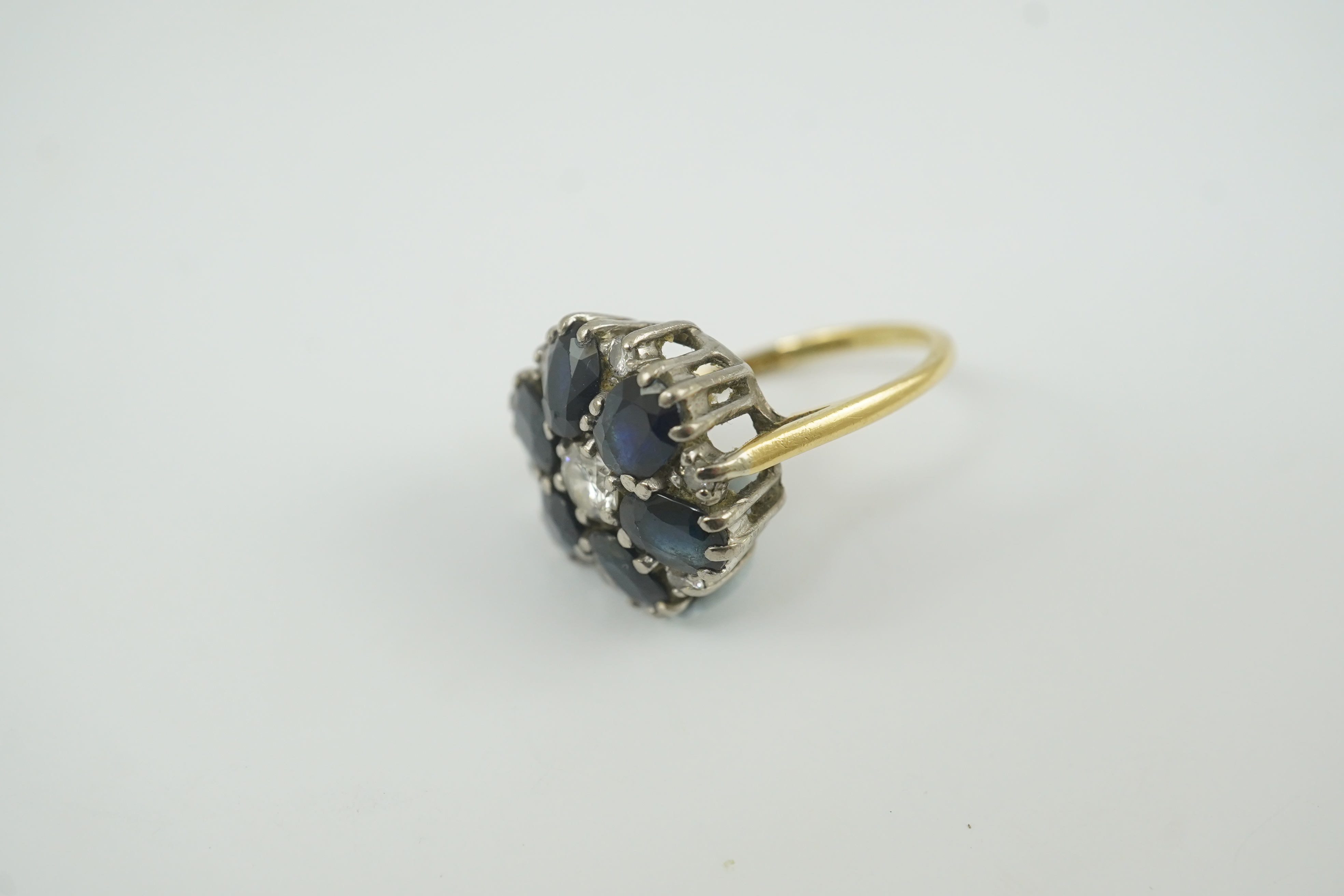 A 1970's 18ct gold, sapphire and diamond set circular cluster ring